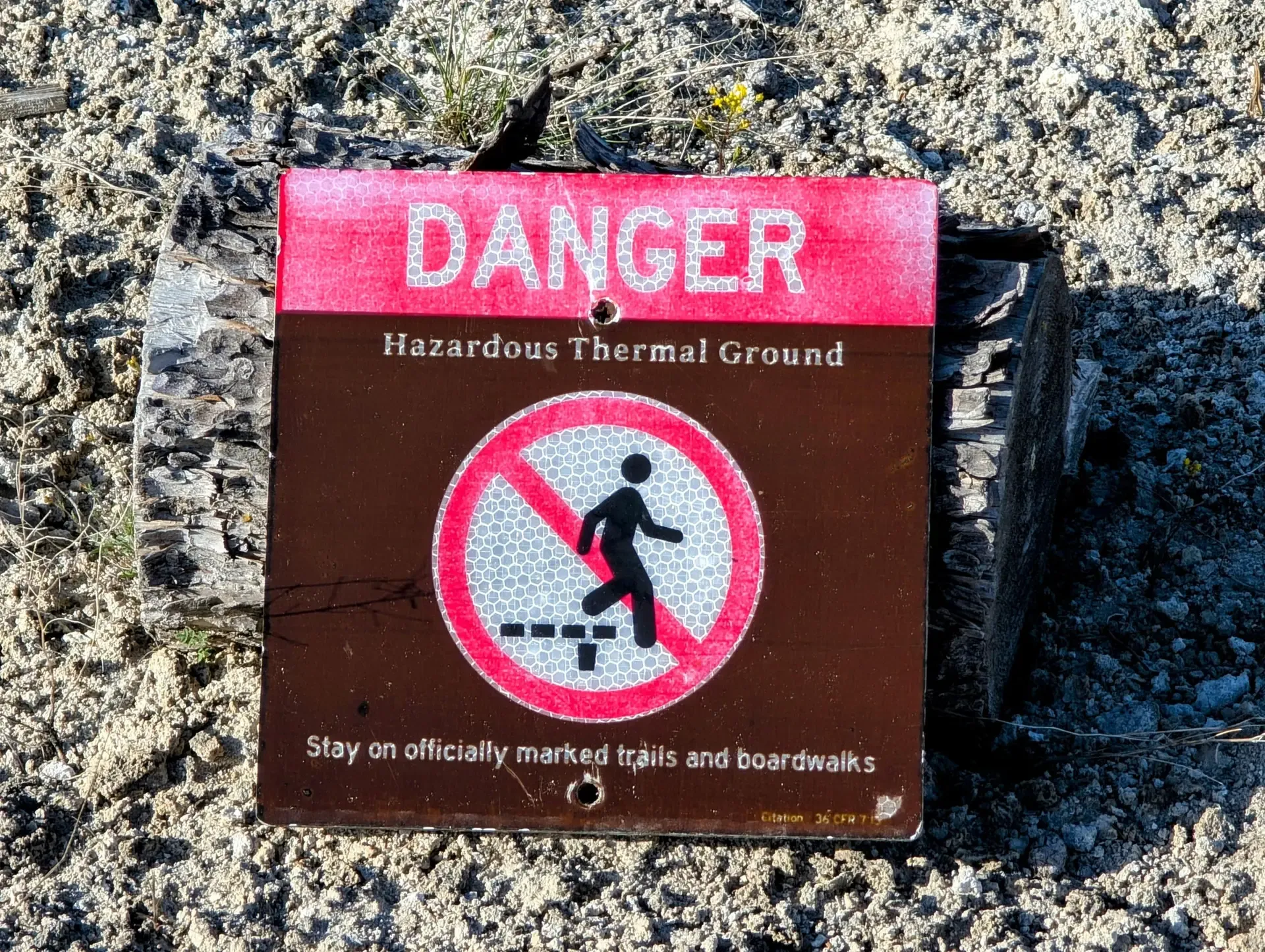 Sign warning of hazardous thermal ground at Yellowstone National Park
