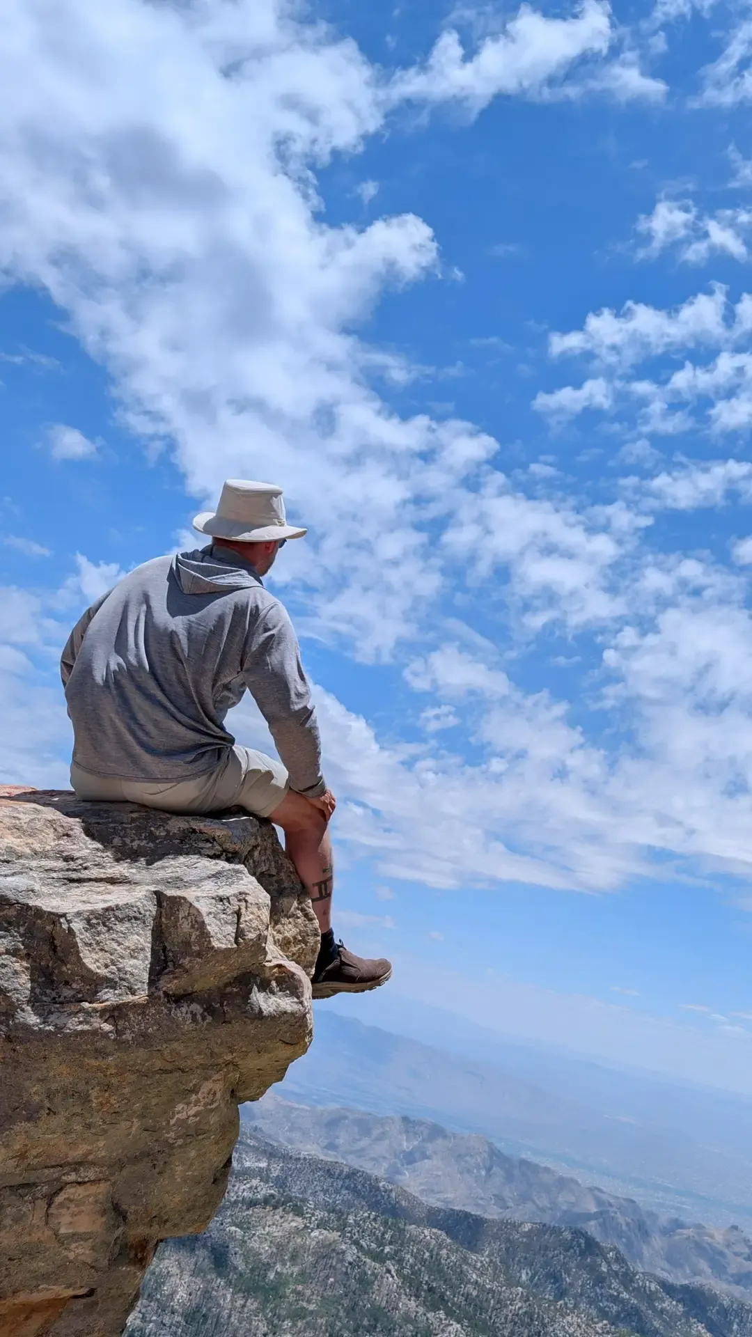 Brett sitting on top of Mount Lemmon, overlooking the desert below