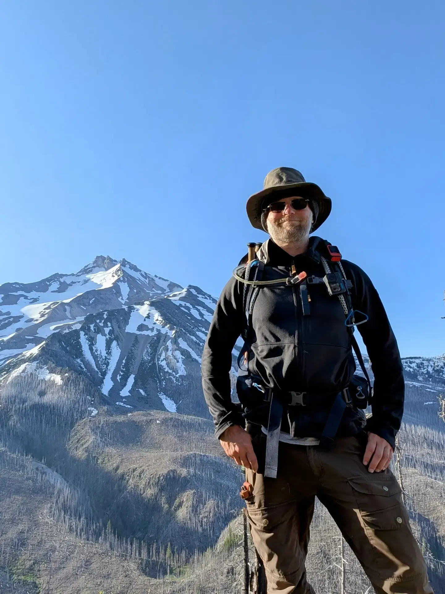 Brett standing in front of Mount Jefferson in Oregon